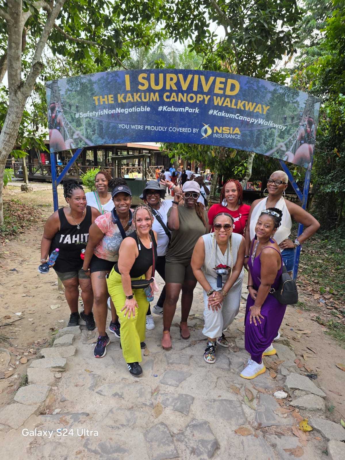 Travelers celebrating after the Kakum Canopy Walkway in Ghana
